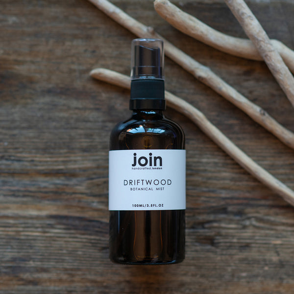 One amber glass bottle of Join Driftwood Botanical Room Mist